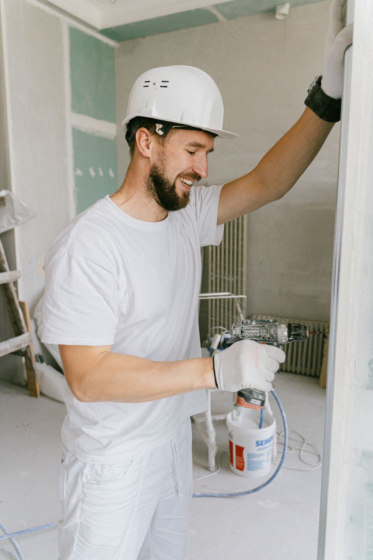 House painter preparing an interior wall — marketing for painting contractors