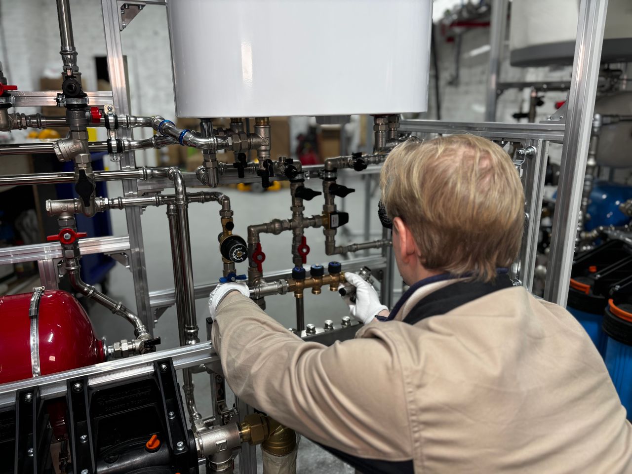 Plumbing contractor working on pipework — plumbing marketing companies and SEO